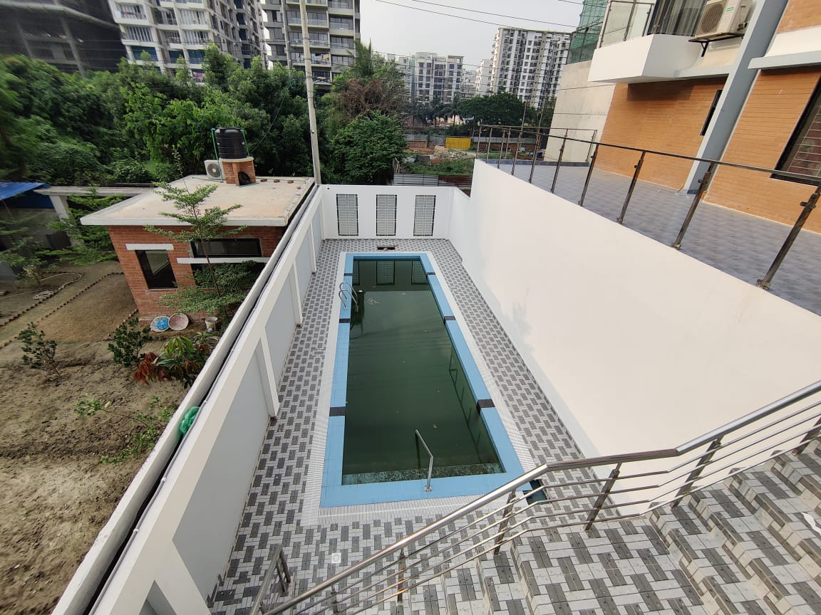South-facing luxury apartment for sale in Bashundhara 5600 square feet apartment Bashundhara Dhaka Premium kitchen with cabinetry in 4 bed flat Bashundhara Spacious living and dining area in 9th floor apartment